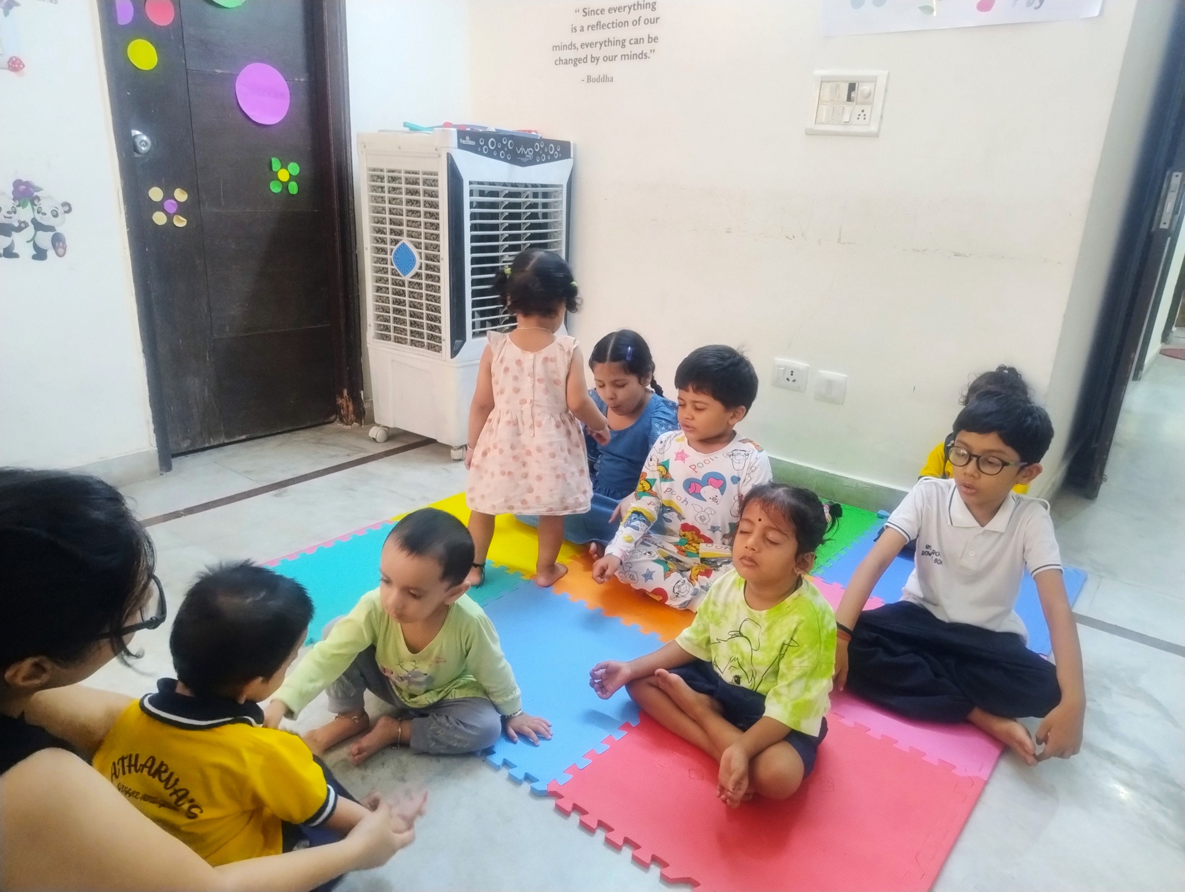 Three children engaged in a learning activity